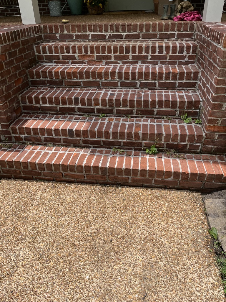 Clean brick front steps after pressure washing