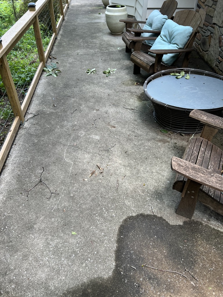 Dirty concrete patio before pressure washing